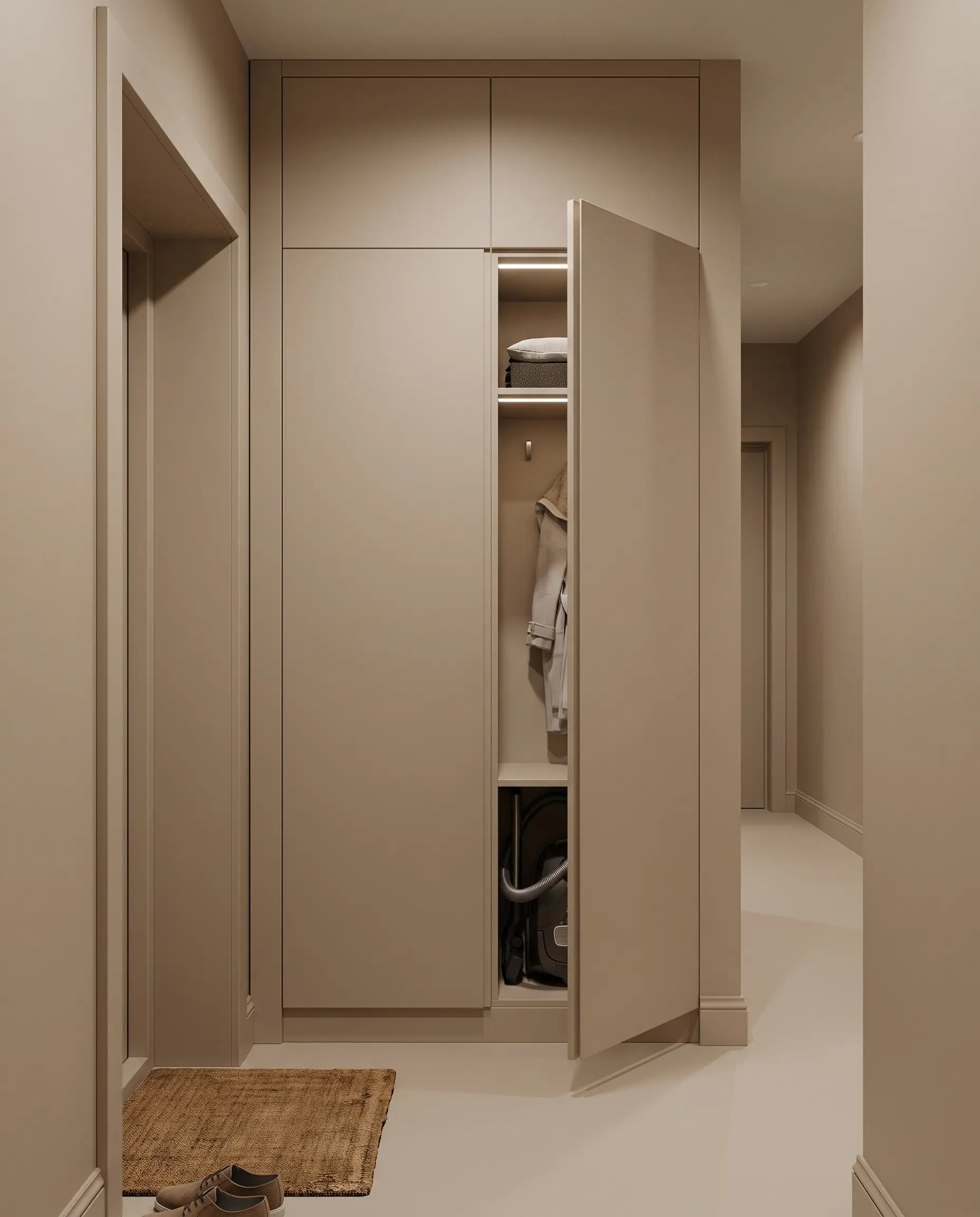 Flat-panel cabinetry and surrounding trim are color-drenched in Farrow & Ball Drop Cloth to completely camouflage a hyper-shallow utility closet reflecting 2027 entryway and mudroom design trends.