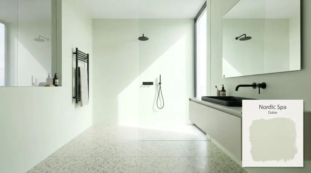 Matte black fixtures and light terrazzo flooring contrast sharply against crisp pale green bathroom walls finished in Dulux Nordic Spa (Hex #EBF5E4).