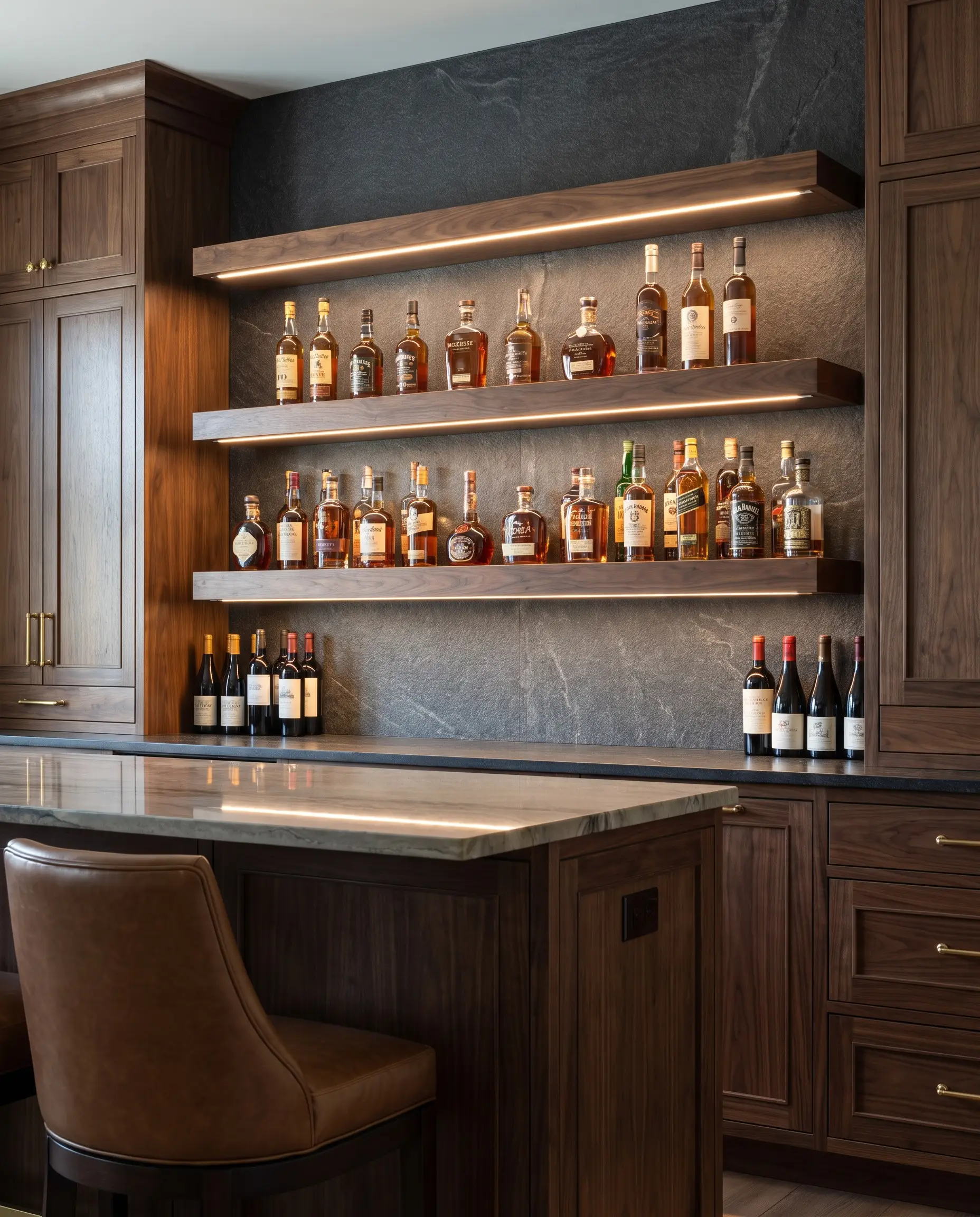 Floating wood shelves feature recessed aluminum-channel micro-LED strips routed directly into the underside to illuminate curated liquor bottles above a textured backsplash.